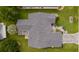 Overhead view of house showing grey roof, screened patio, and landscaping at 17913 Se 88Th Cascade Ct, The Villages, FL 32162