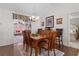 Spacious dining room featuring a wood table and access to a sunroom at 17913 Se 88Th Cascade Ct, The Villages, FL 32162
