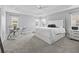 Main bedroom with a king-size bed and an office area at 3162 Webster Way, The Villages, FL 32163