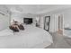 Spacious main bedroom with a large bed and access to the bathroom at 3162 Webster Way, The Villages, FL 32163