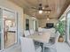 Relaxing sunroom with comfortable seating and access to the outdoors at 3162 Webster Way, The Villages, FL 32163