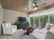 Sunroom with comfortable seating and a large TV at 3162 Webster Way, The Villages, FL 32163