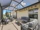 Relaxing screened patio with seating area, perfect for outdoor enjoyment at 3162 Webster Way, The Villages, FL 32163