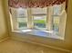 Built-in window seat with storage and window coverings offers a peaceful view at 1213 El Esparza Ln, The Villages, FL 32159