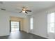 Living room with sliding doors to screened porch at 27231 White Plains Way, Leesburg, FL 34748