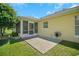 Screened patio with concrete slab and backyard access at 1213 El Esparza Ln, The Villages, FL 32159