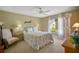 Cozy bedroom with a queen-size bed and large window at 1213 El Esparza Ln, The Villages, FL 32159
