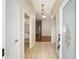 Bright entryway with tile flooring and laundry closet at 306 Bishopville Loop # 117, The Villages, FL 32162