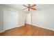 Bright bedroom featuring wood floors and ceiling fan at 306 Bishopville Loop # 117, The Villages, FL 32162