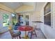 Cozy sunroom featuring a round table and chairs, with access to the backyard at 6401 Tildon, Leesburg, FL 34748
