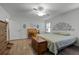 Spacious main bedroom with hardwood floors and a ceiling fan at 6401 Tildon, Leesburg, FL 34748