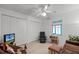 Bright bedroom with double closets, window, and seating area at 6401 Tildon, Leesburg, FL 34748