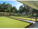 Well-maintained shuffleboard courts under covered area at 6401 Tildon, Leesburg, FL 34748