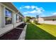 Landscaped backyard with a patio and lawn at 6401 Tildon, Leesburg, FL 34748