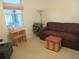 Relaxing living room with sofa, ottoman, and window at 6401 Tildon, Leesburg, FL 34748