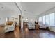 Spacious living room with hardwood floors, comfortable recliners, and large windows at 6401 Tildon, Leesburg, FL 34748