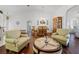 Bright living room with hardwood floors and seating area at 6401 Tildon, Leesburg, FL 34748