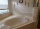 Relaxing bathroom with a large soaking tub and neutral tile at 6401 Tildon, Leesburg, FL 34748