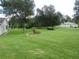 Spacious backyard with lush grass and mature trees at 6401 Tildon, Leesburg, FL 34748