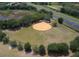 Community baseball field with surrounding trees and highway access at 6401 Tildon, Leesburg, FL 34748