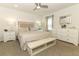 King-size bed, dresser and a ceiling fan in a spacious room at 2019 Majorca Dr, Kissimmee, FL 34747