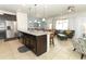Open kitchen with island seating and views into the living room at 2019 Majorca Dr, Kissimmee, FL 34747