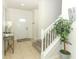 Bright entryway with stairs, storage, and tiled floor at 2019 Majorca Dr, Kissimmee, FL 34747