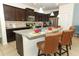 Eat-in kitchen with granite island and stainless steel appliances at 2019 Majorca Dr, Kissimmee, FL 34747