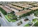 Aerial view of a community featuring many townhouses and a gated entrance at 2019 Majorca Dr, Kissimmee, FL 34747