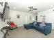 L-shaped sectional sofa and a large TV in a bright living area at 2019 Majorca Dr, Kissimmee, FL 34747