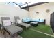 Relax on the patio with a sectional sofa and chaise lounges at 2019 Majorca Dr, Kissimmee, FL 34747