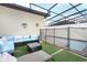 Private pool and patio with seating and artificial turf at 2019 Majorca Dr, Kissimmee, FL 34747
