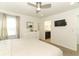 Bright bedroom with a large bed, dresser, and TV at 2019 Majorca Dr, Kissimmee, FL 34747