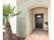 Inviting entryway to a townhome with a dark brown door and brick pathway at 2019 Majorca Dr, Kissimmee, FL 34747