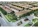 Aerial view of a community featuring many townhouses and a gated entrance at 2019 Majorca Dr, Kissimmee, FL 34747