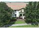 Townhouse exterior with two-story design and lush landscaping at 2019 Majorca Dr, Kissimmee, FL 34747