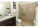 Clean bathroom with shower, toilet and granite countertop at 2019 Majorca Dr, Kissimmee, FL 34747