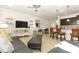 Open living room features a comfortable seating area and flows into the kitchen at 2019 Majorca Dr, Kissimmee, FL 34747