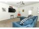 Relaxing living area with sectional sofa and large TV at 2019 Majorca Dr, Kissimmee, FL 34747