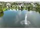 Community features a lake with a fountain and clubhouse at 2019 Majorca Dr, Kissimmee, FL 34747