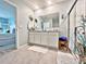 Elegant bathroom with double vanity and walk-in shower at 1771 Henin Cir, Tavares, FL 32778