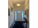 Well-lit entryway with a console table and hardwood floors at 16360 Sw 15Th Ct, Ocala, FL 34473