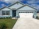 Charming curb appeal with a two-car garage at 1771 Henin Cir, Tavares, FL 32778