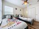 bedroom with two twin beds and Mickey Mouse bedding at 426 Orange Cosmos Blvd, Davenport, FL 33837