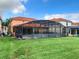 Home with large backyard, pool and screened enclosure at 426 Orange Cosmos Blvd, Davenport, FL 33837
