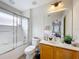 Bathroom with tub, shower, and wood vanity at 426 Orange Cosmos Blvd, Davenport, FL 33837