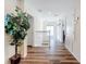 Upstairs hallway with hardwood floors and white railings at 426 Orange Cosmos Blvd, Davenport, FL 33837