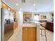 Spacious kitchen with stainless steel appliances and an island at 426 Orange Cosmos Blvd, Davenport, FL 33837