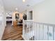 Upstairs hallway with hardwood floors and a built-in workspace at 426 Orange Cosmos Blvd, Davenport, FL 33837