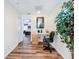 Upstairs study with a workspace and hardwood floors at 426 Orange Cosmos Blvd, Davenport, FL 33837